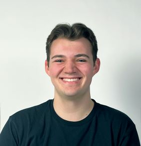 headshot of ben in black shirt in front of white background